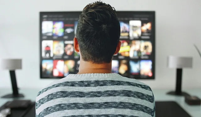 new year, man, tv, watching, room, office, modern, technology, screen, watching control, home, desk, table, concept, video, netflix, entertainment, media, digital, film, presentation, play, network, searches, episode, movies. Connected TV advertising for Australian brands